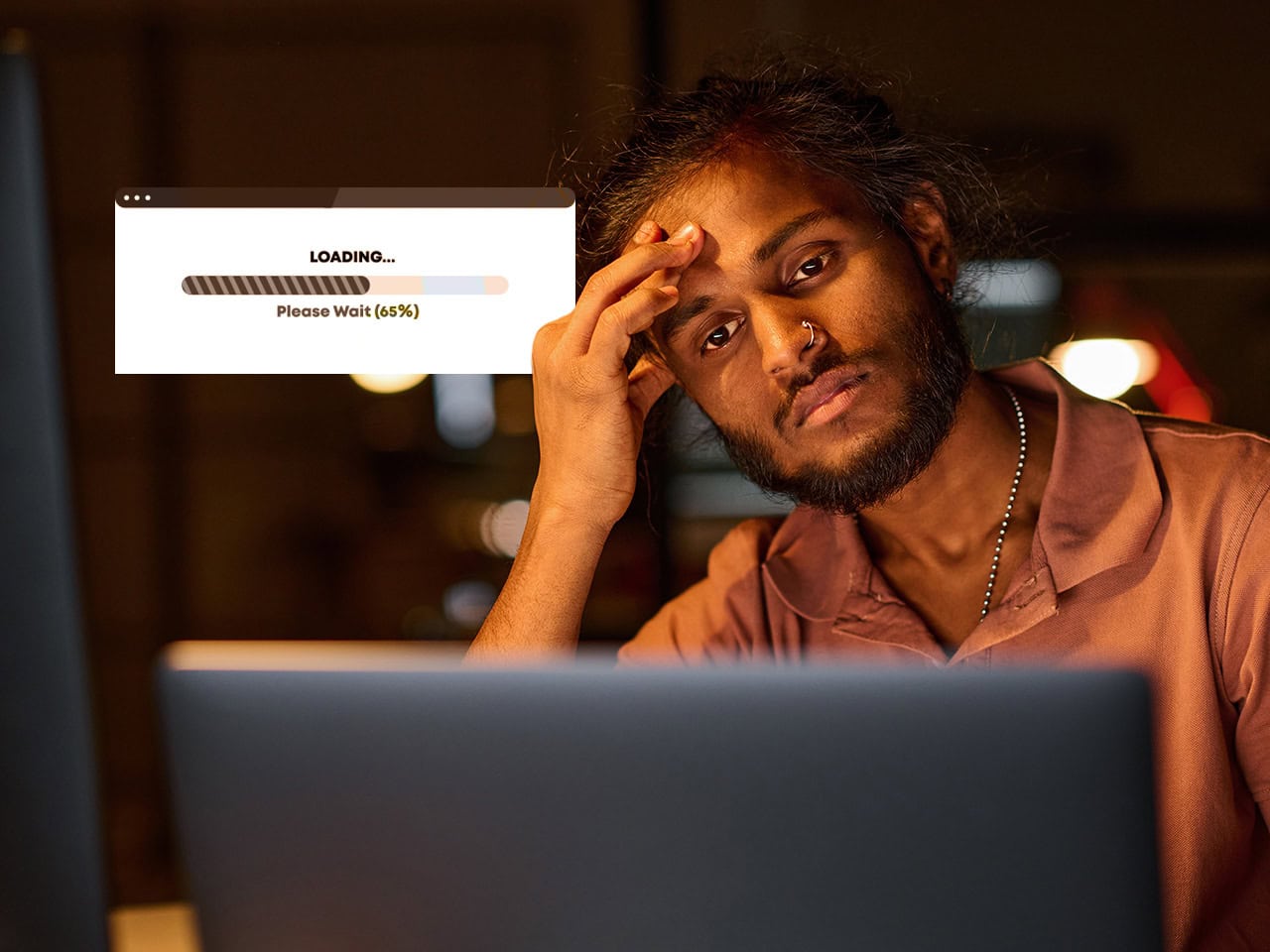 Man bored of loading screen on his laptop