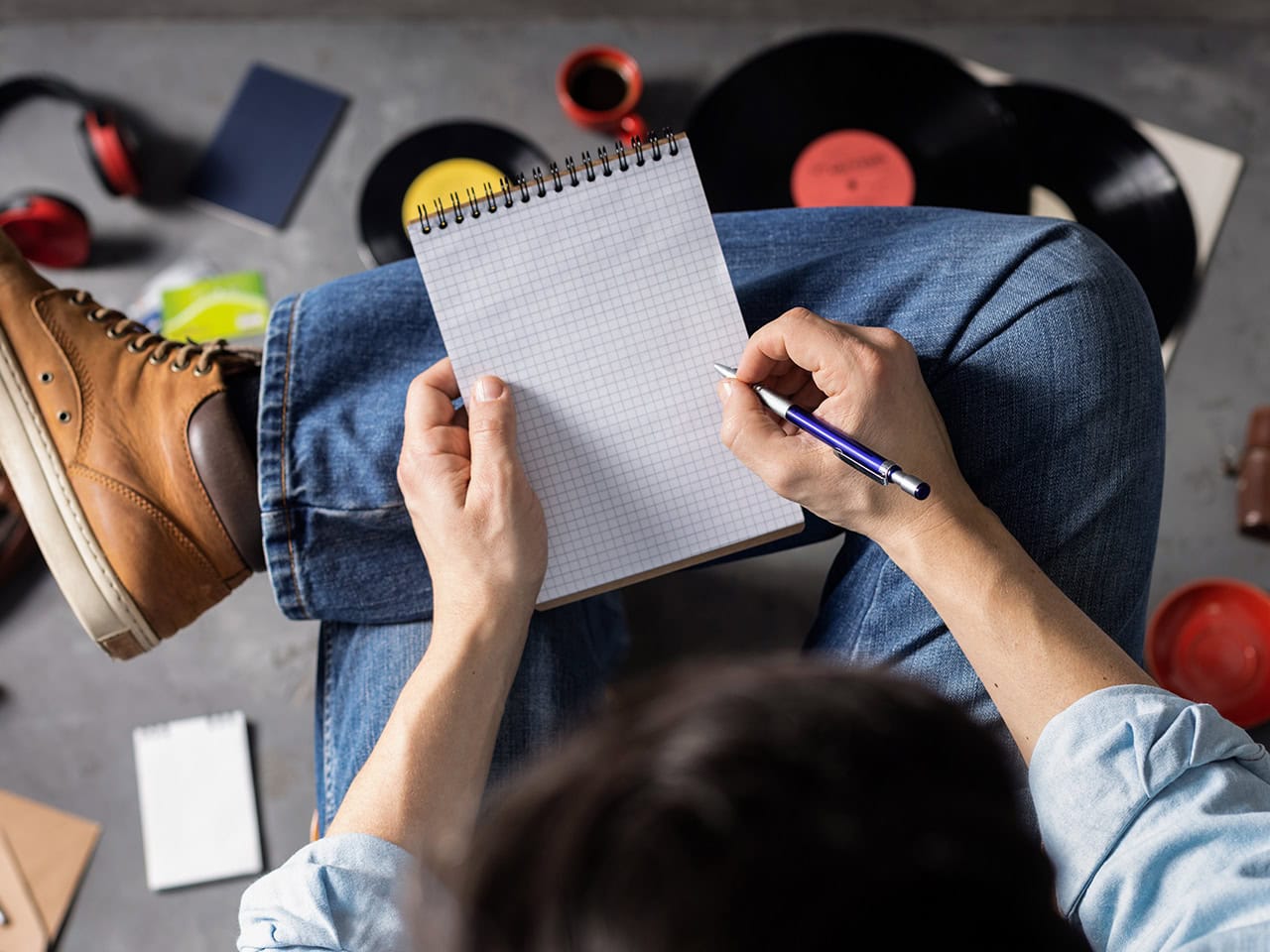 man sitting down ready to write notes